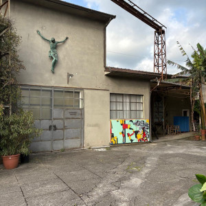 concrete art studio building with crane.