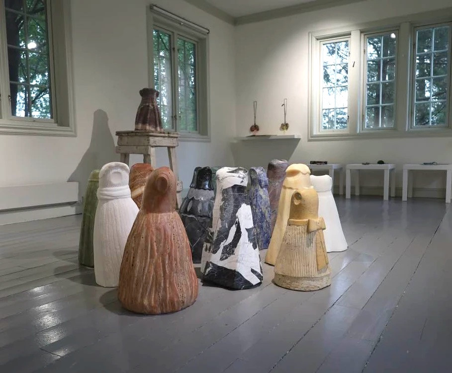 marble sculptures of dresses in different colours and styles