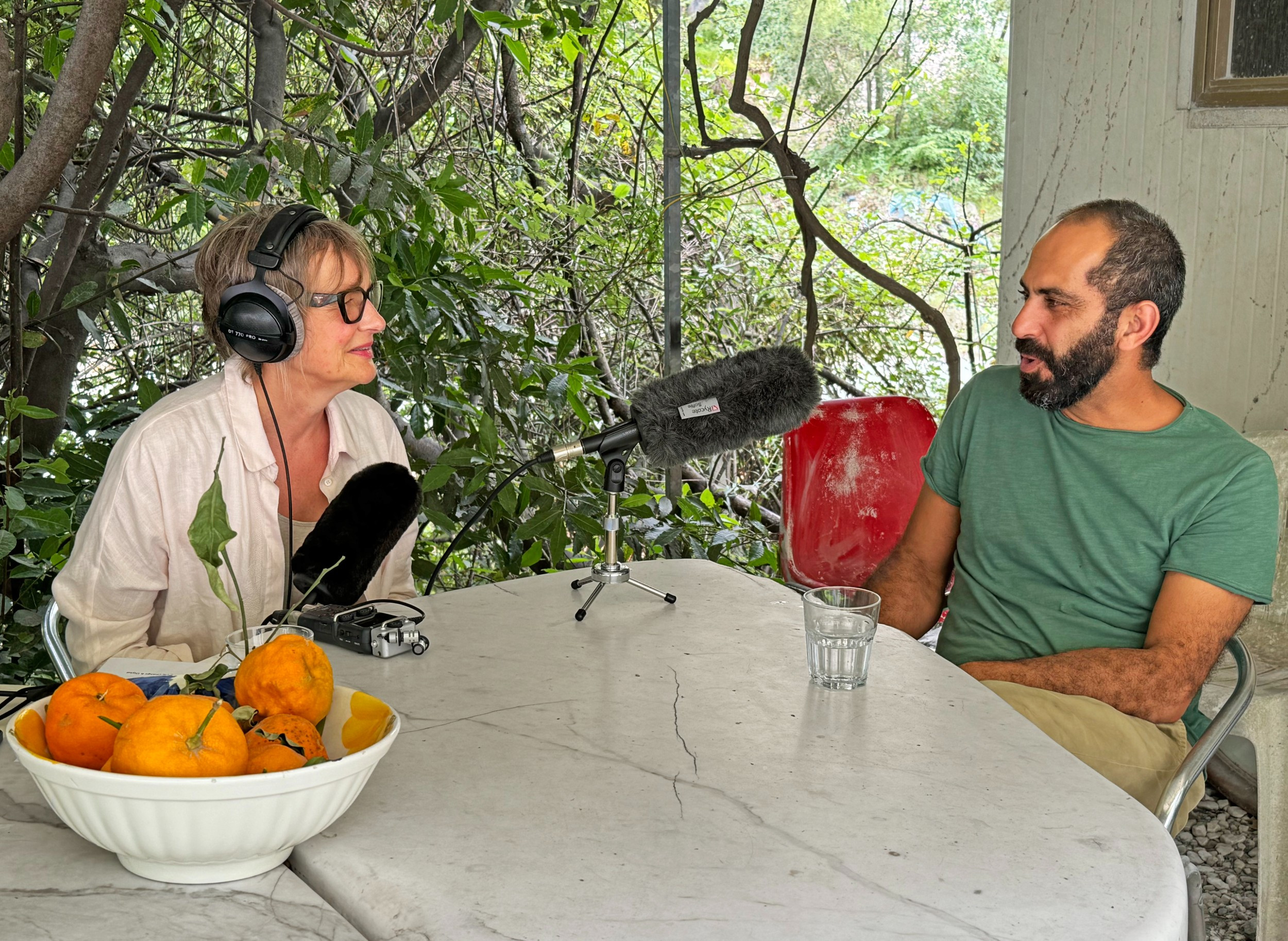 woman interviewing man for a podcast