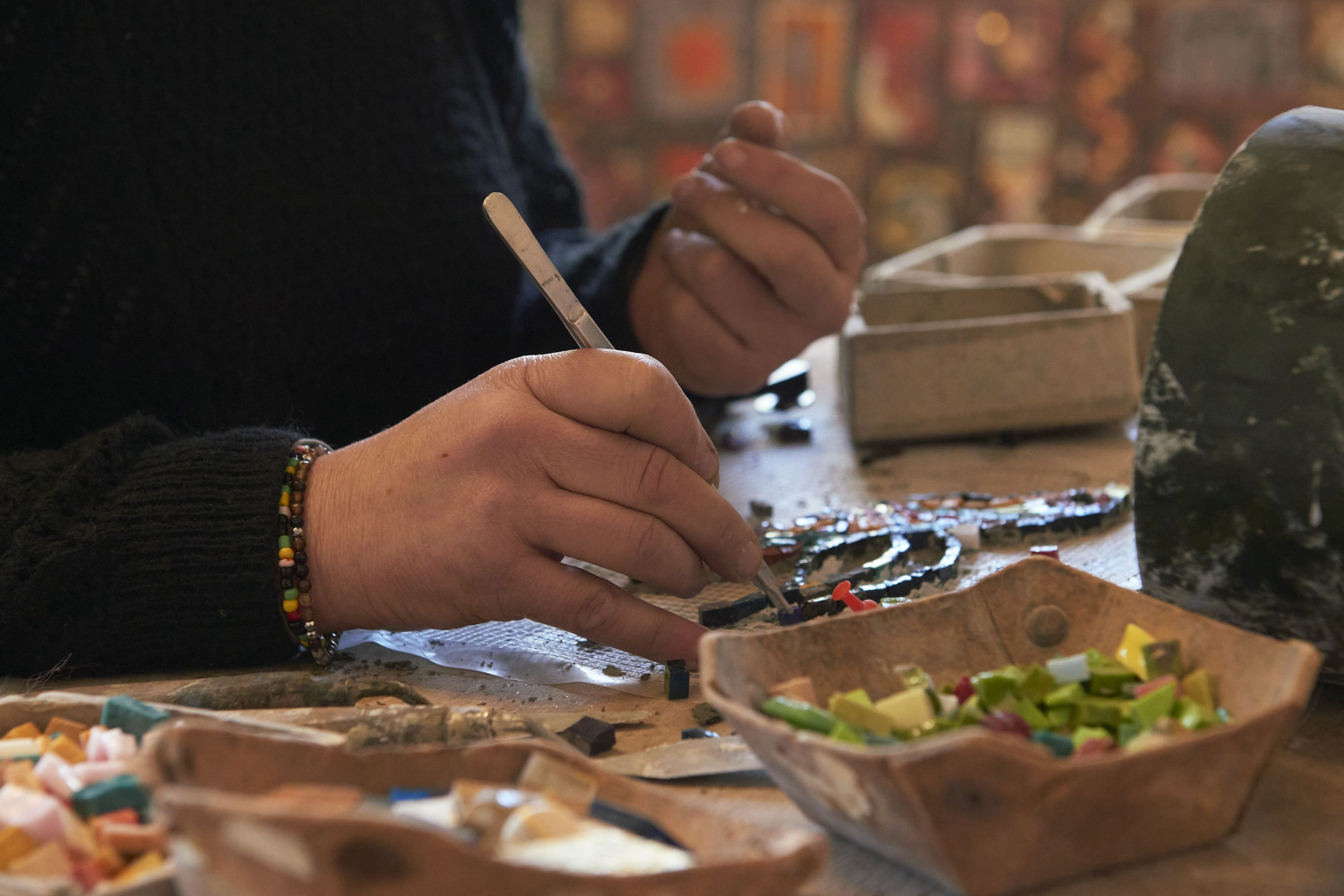 Close-up of mosaic artist placing pieces