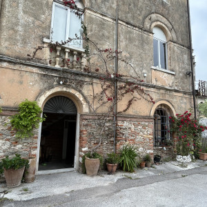 stone building entrance to Ursula Corsi's mosaic studio.