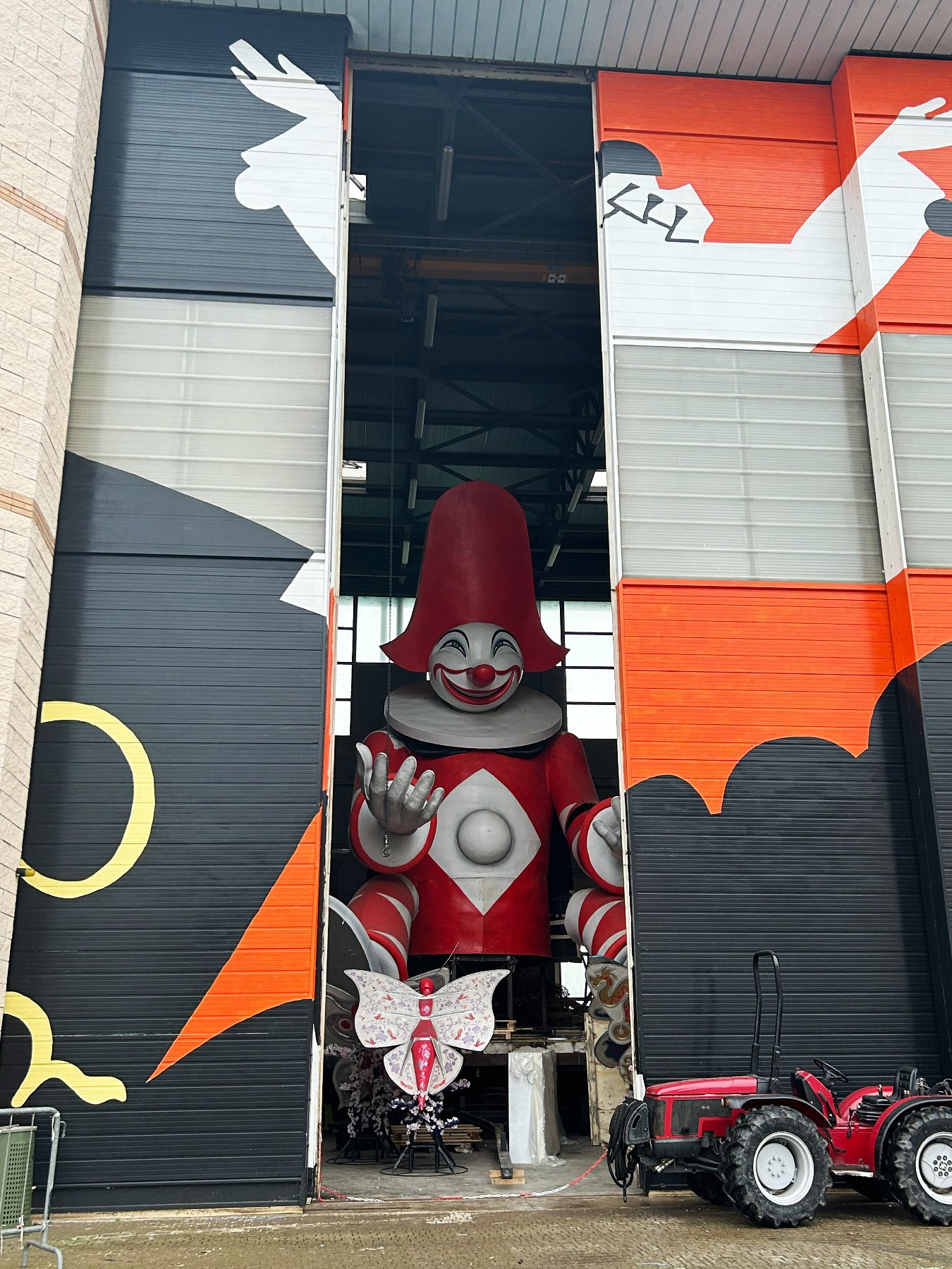 sculpture of Burlamacco in a large factory hanger