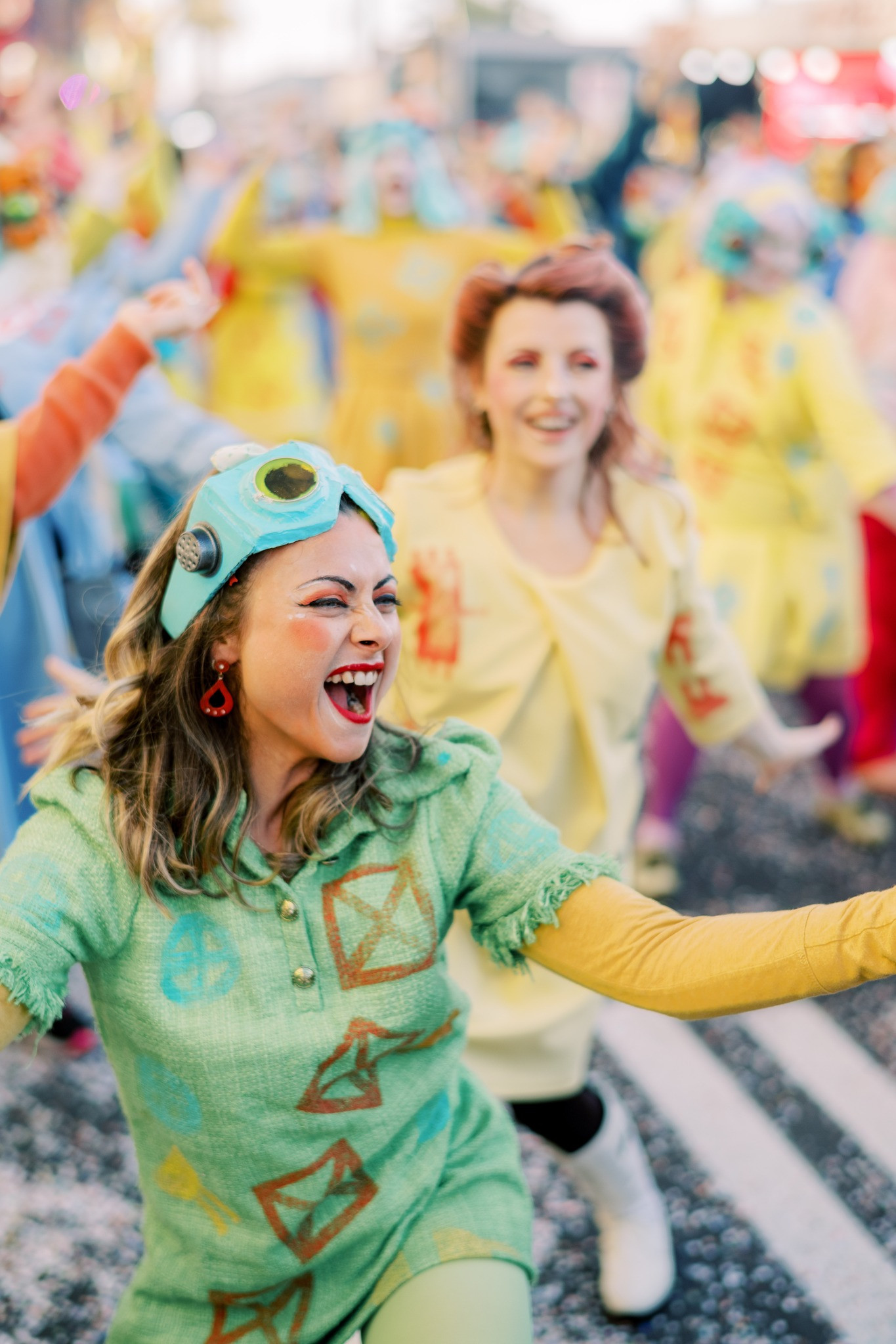 smiling dancers with colourful costumes