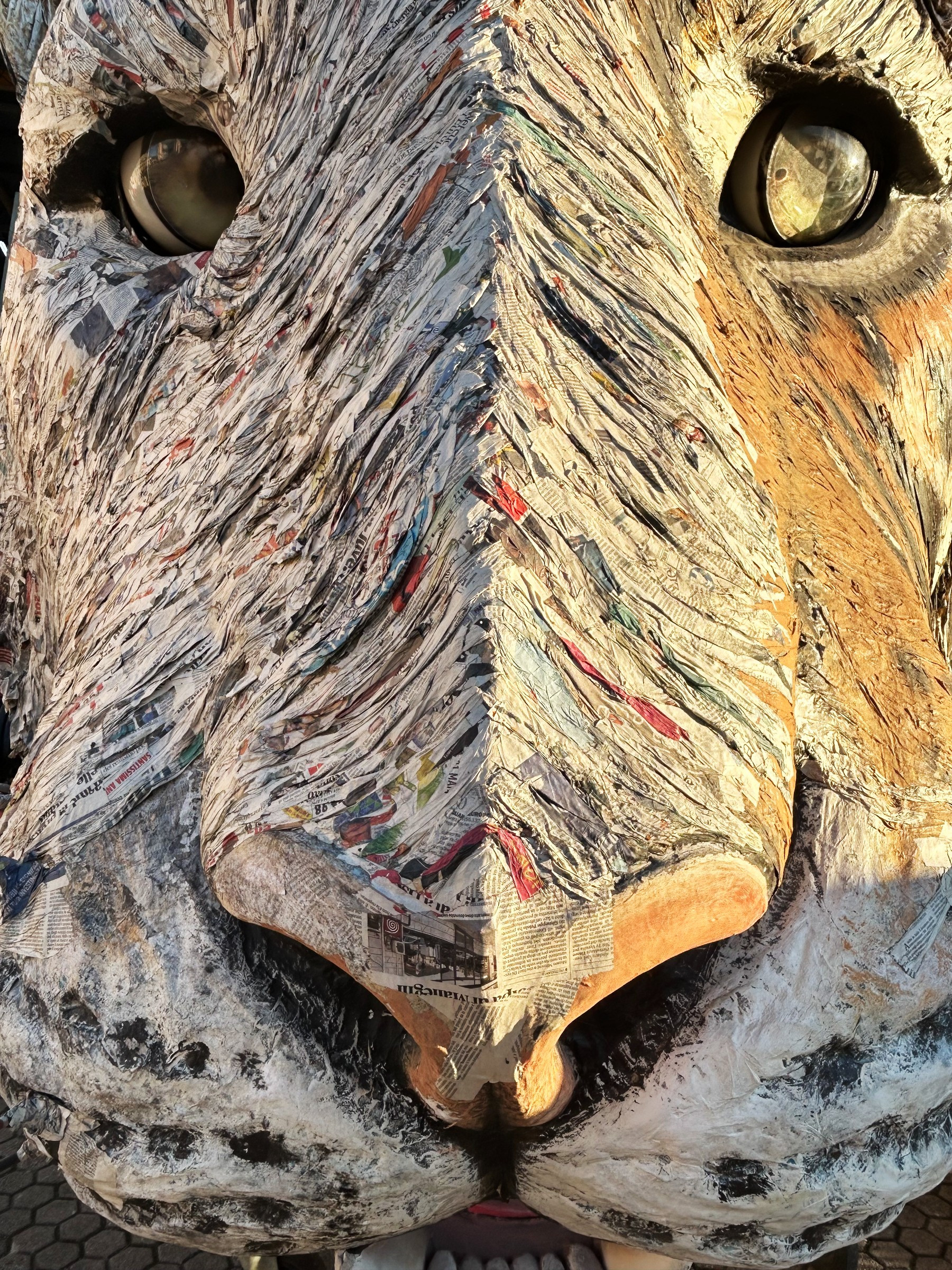 close-up of papier-mâché lion's face