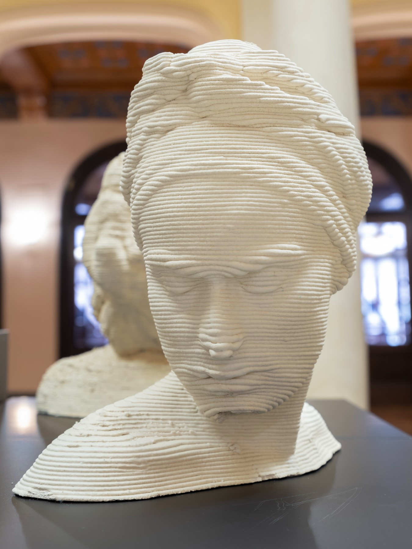 3D printed head of a woman with headscarf, made with thick layers