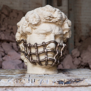 3D print of Michelangelo's David with a facemask made of thick metal wire