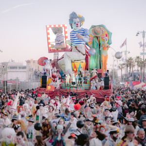 colourful carnival parade with large float of a clown