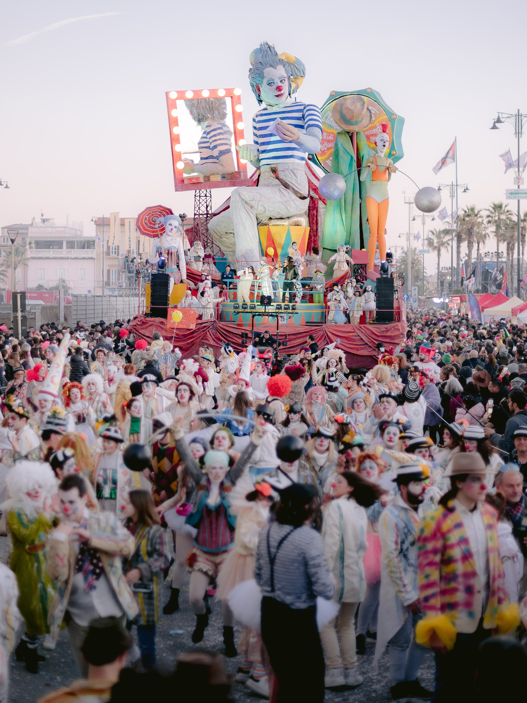 colourful carnival parade with large float of a clown