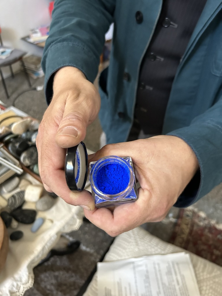 a jar of bright blue powder