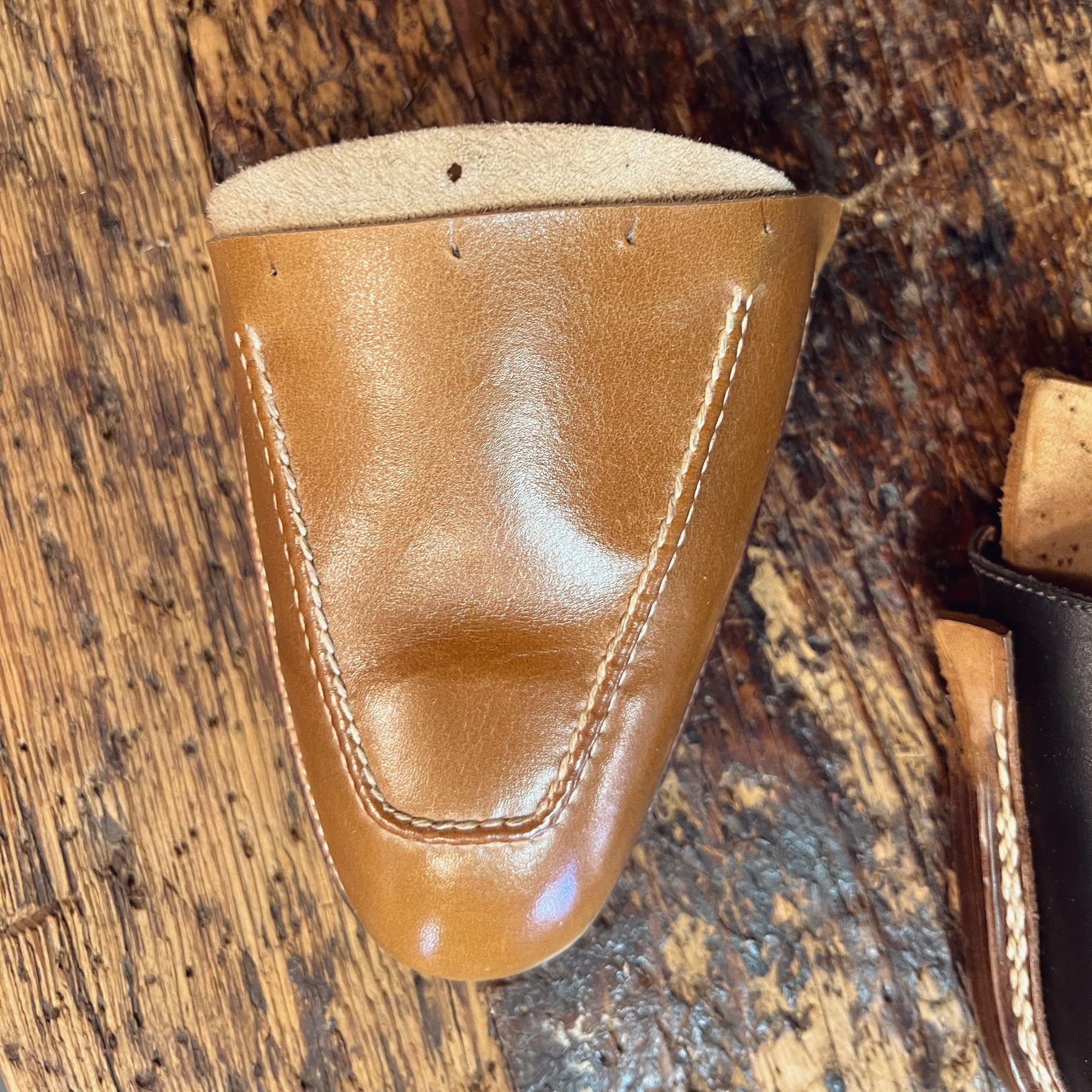 partially made toe portion of a leather shoe