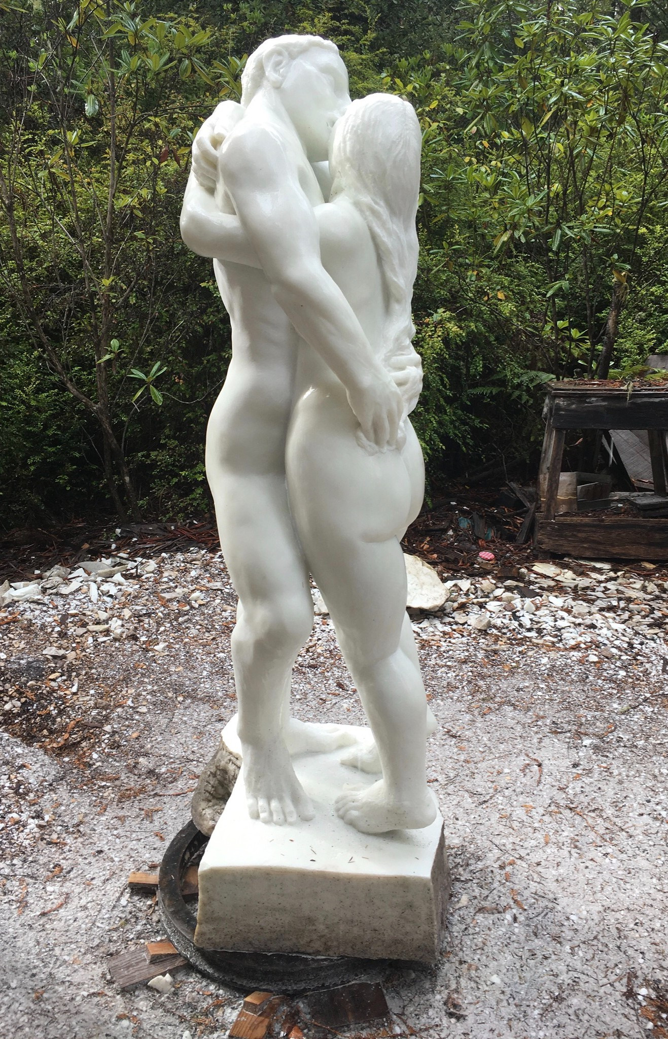 marble sculpture of nude man and woman embracing