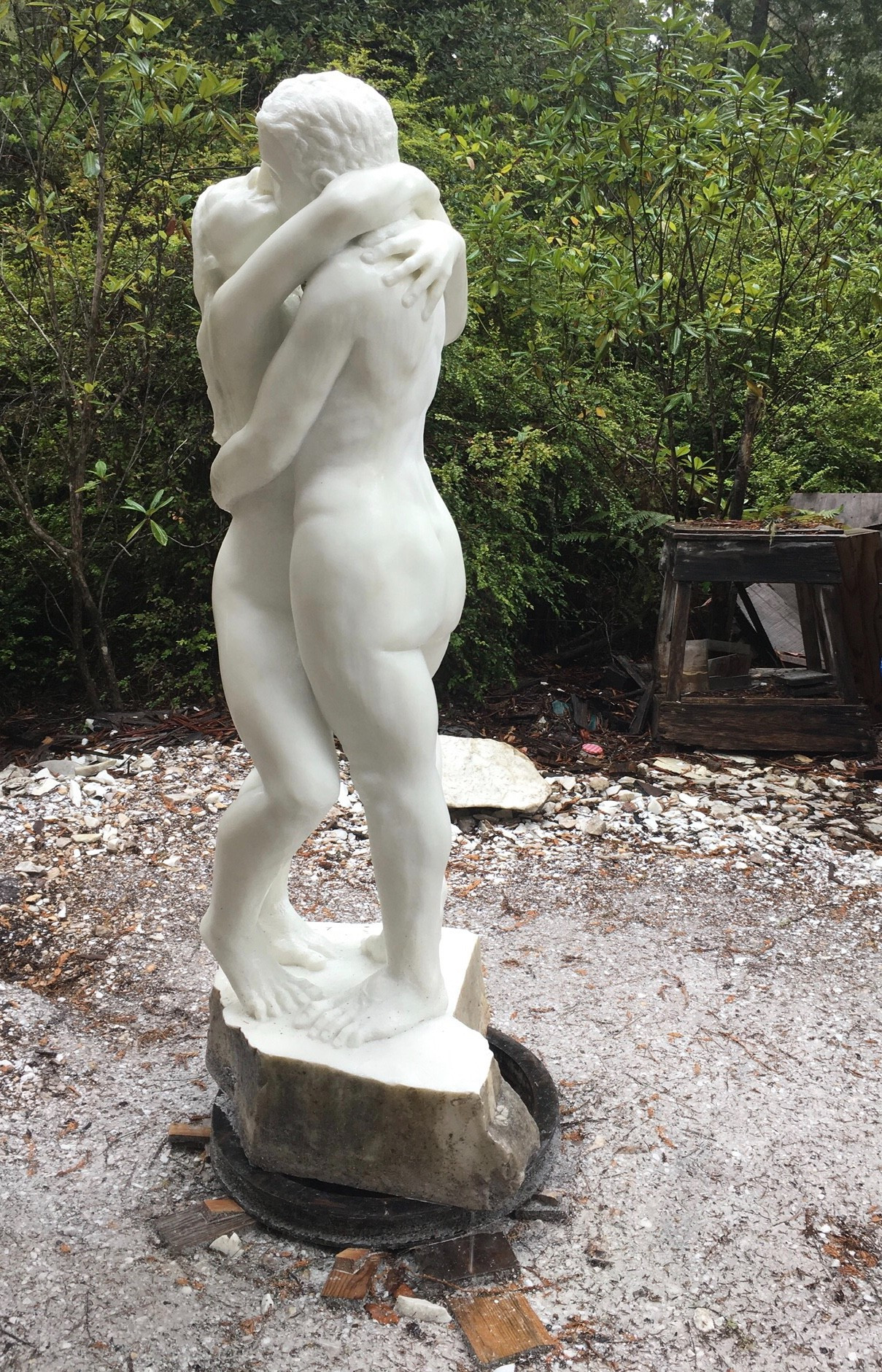 marble sculpture of nude man and woman embracing