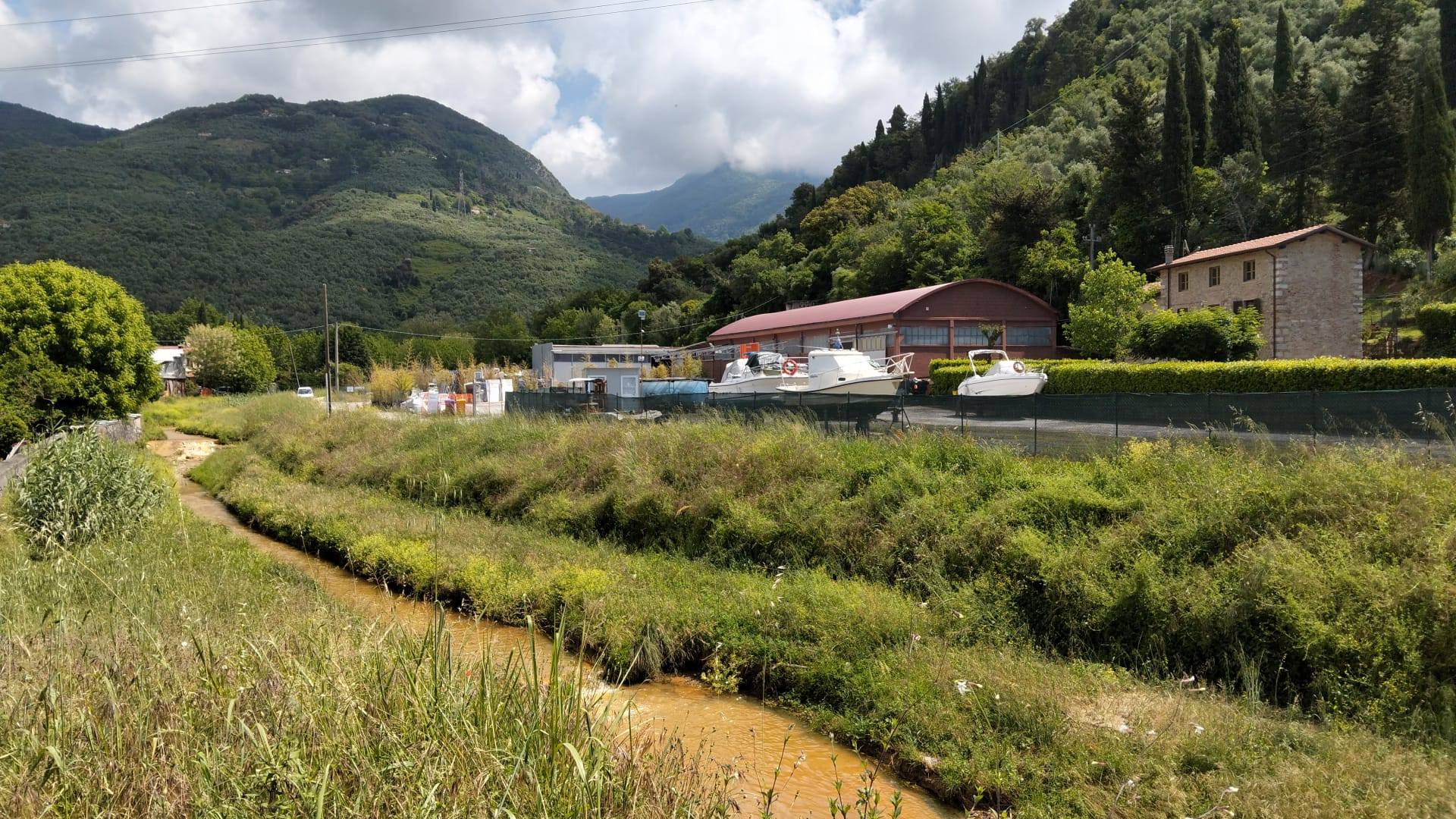 Artist studio set in the Italian countryside surrounded by mountains and a river