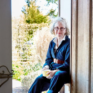 woman sat in sunny doorway