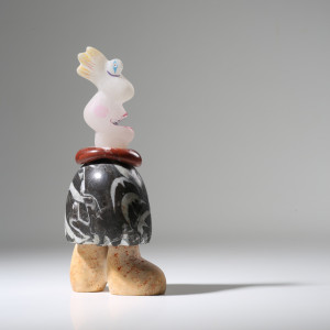 sculpture of figure made from a variety of stone types