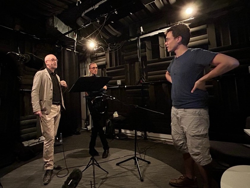 three men in an audio studio