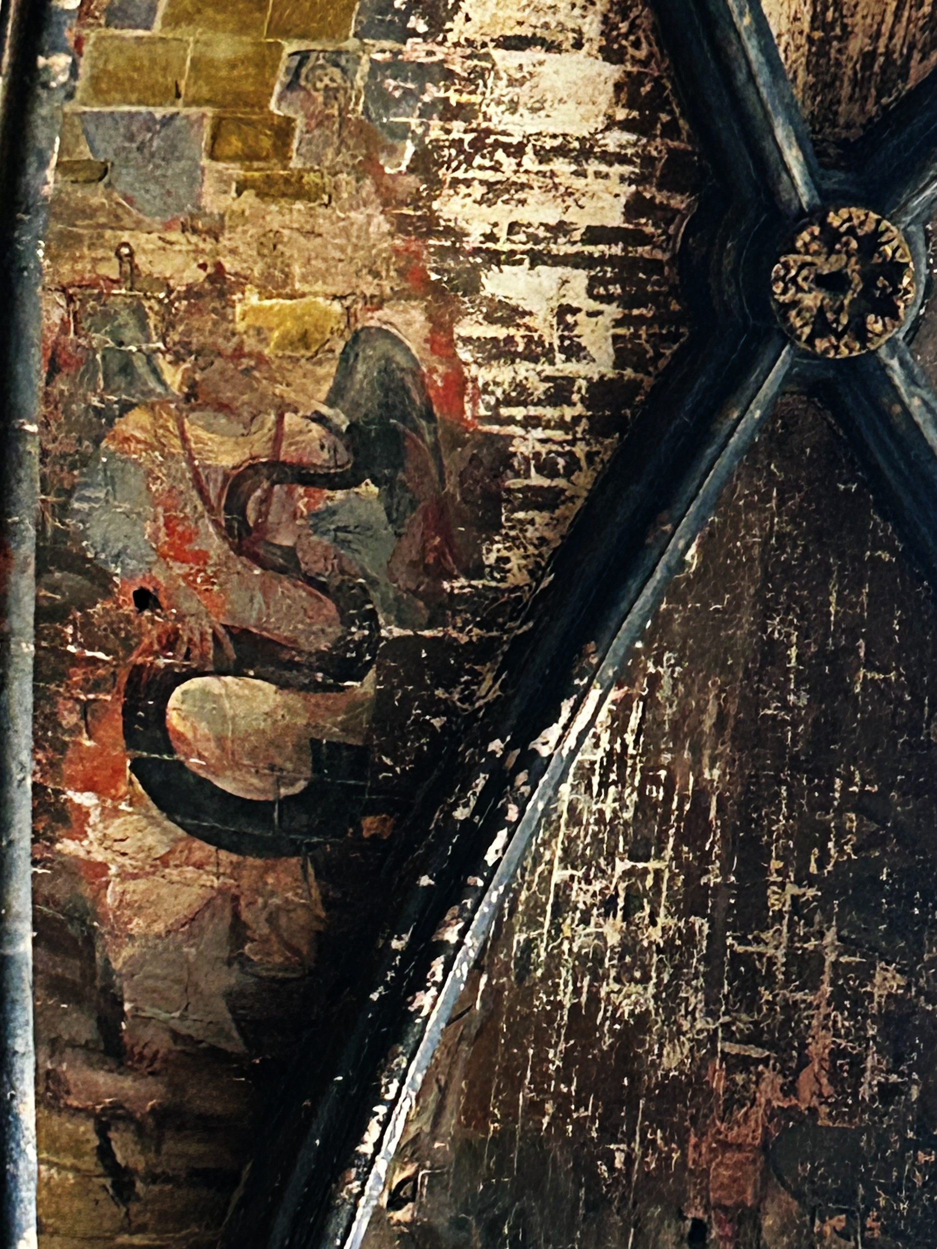 fresco of a serpent (instrument) on cathedral ceiling