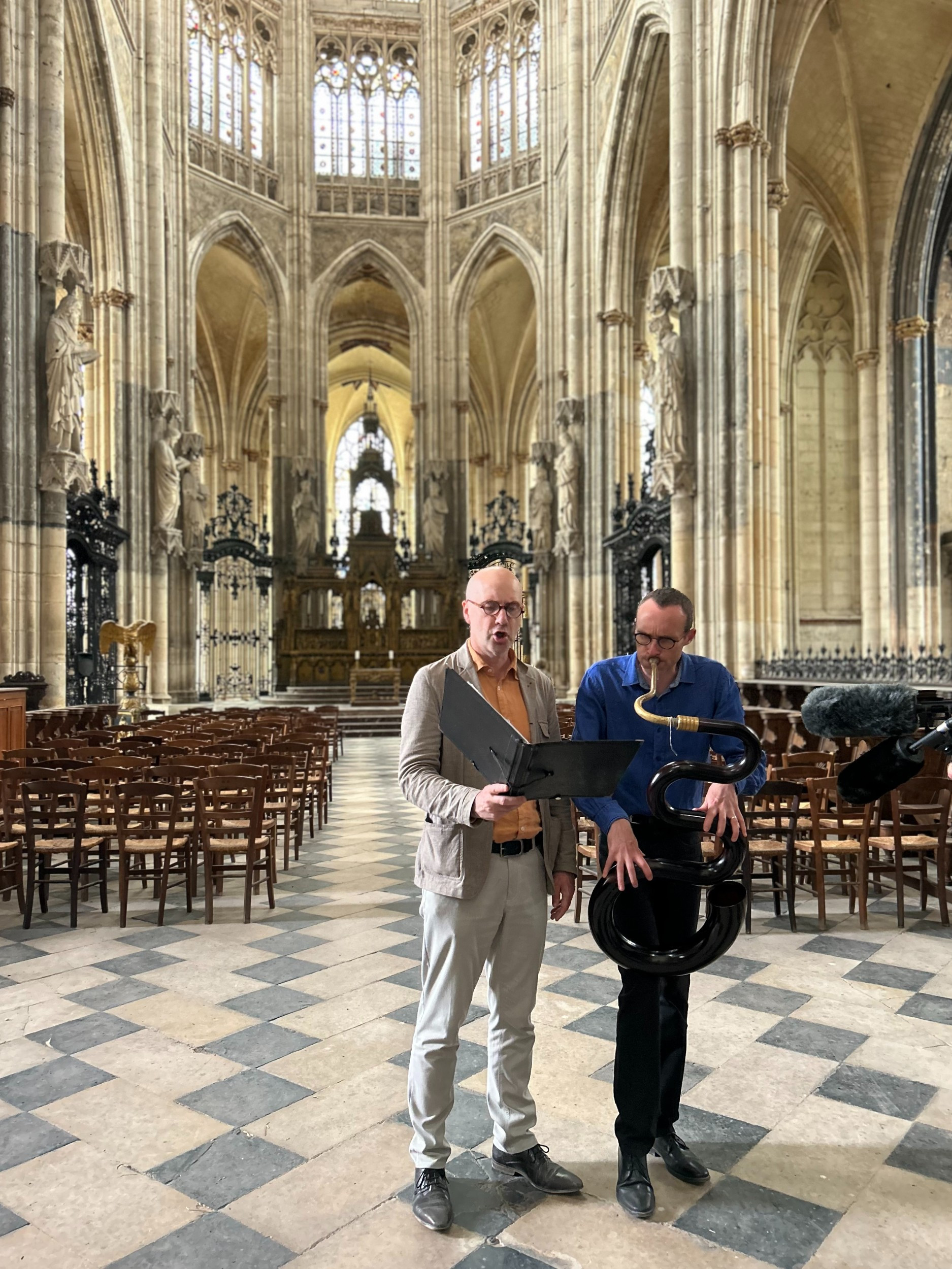 singer and sepent player in a cathedral