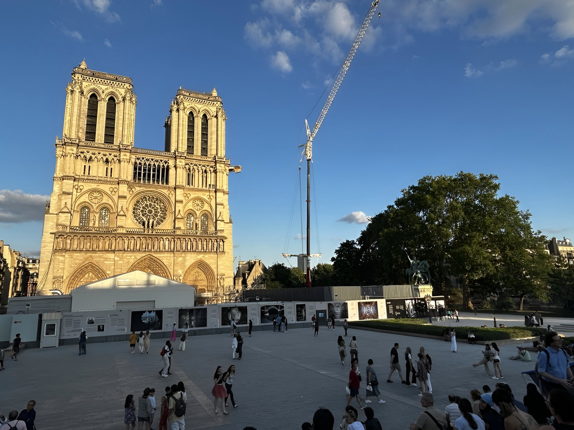 Notre-Dame cathedral with blue sky and a crane