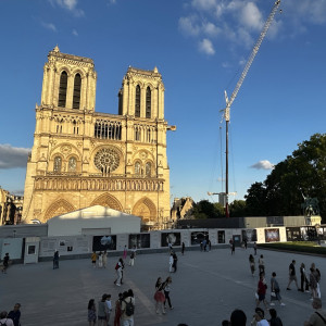 Notre-Dame cathedral with blue sky and a crane