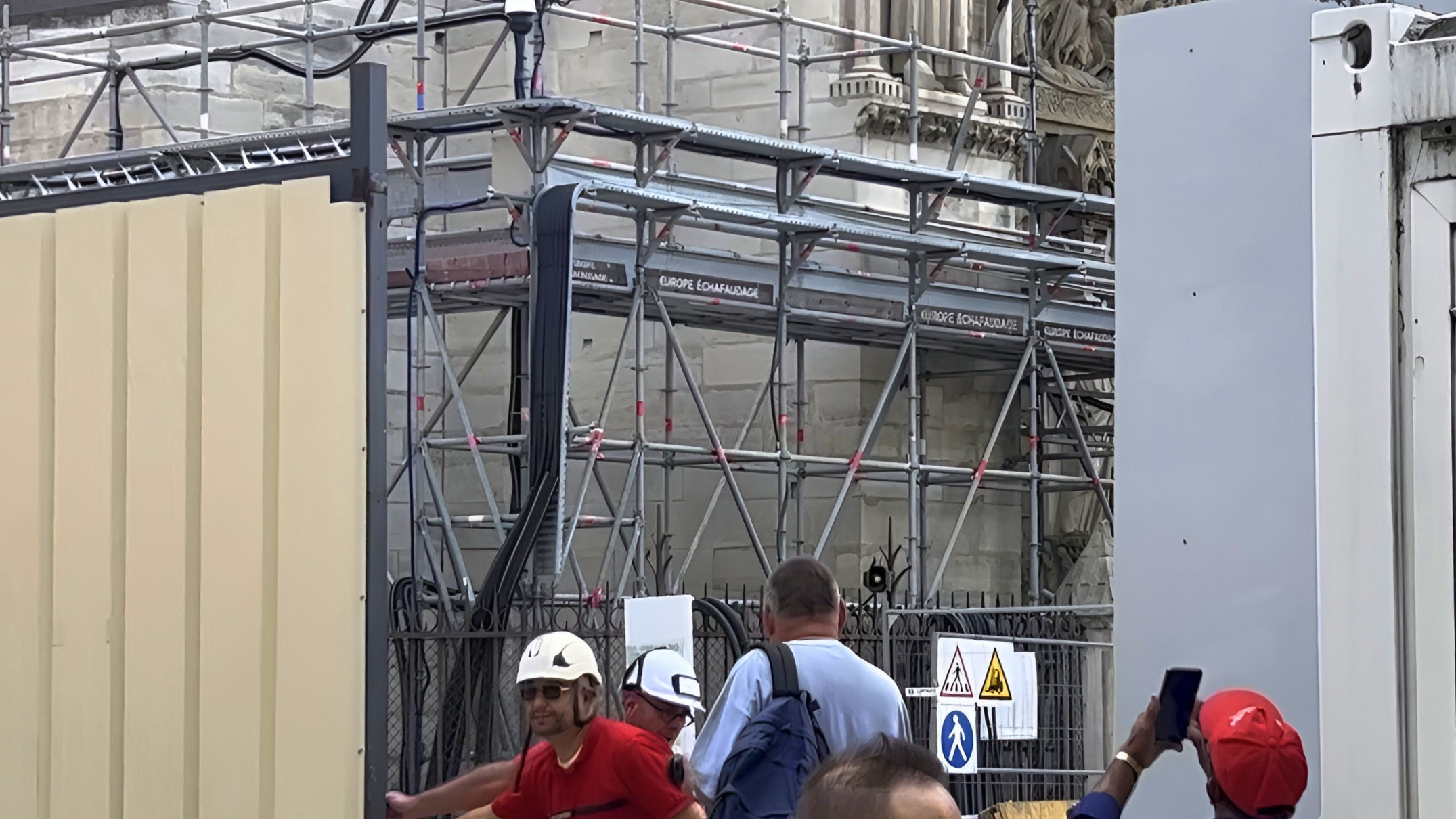 construction site entrance with tourists taking pictures